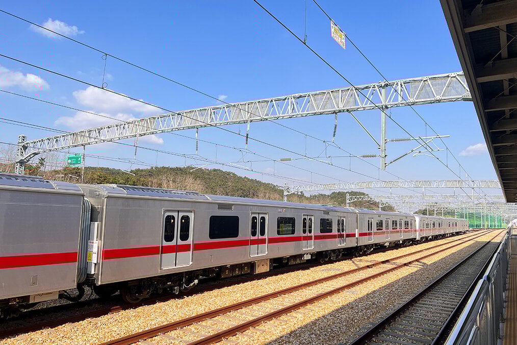 A train sitting at a station in Busan, South Korea